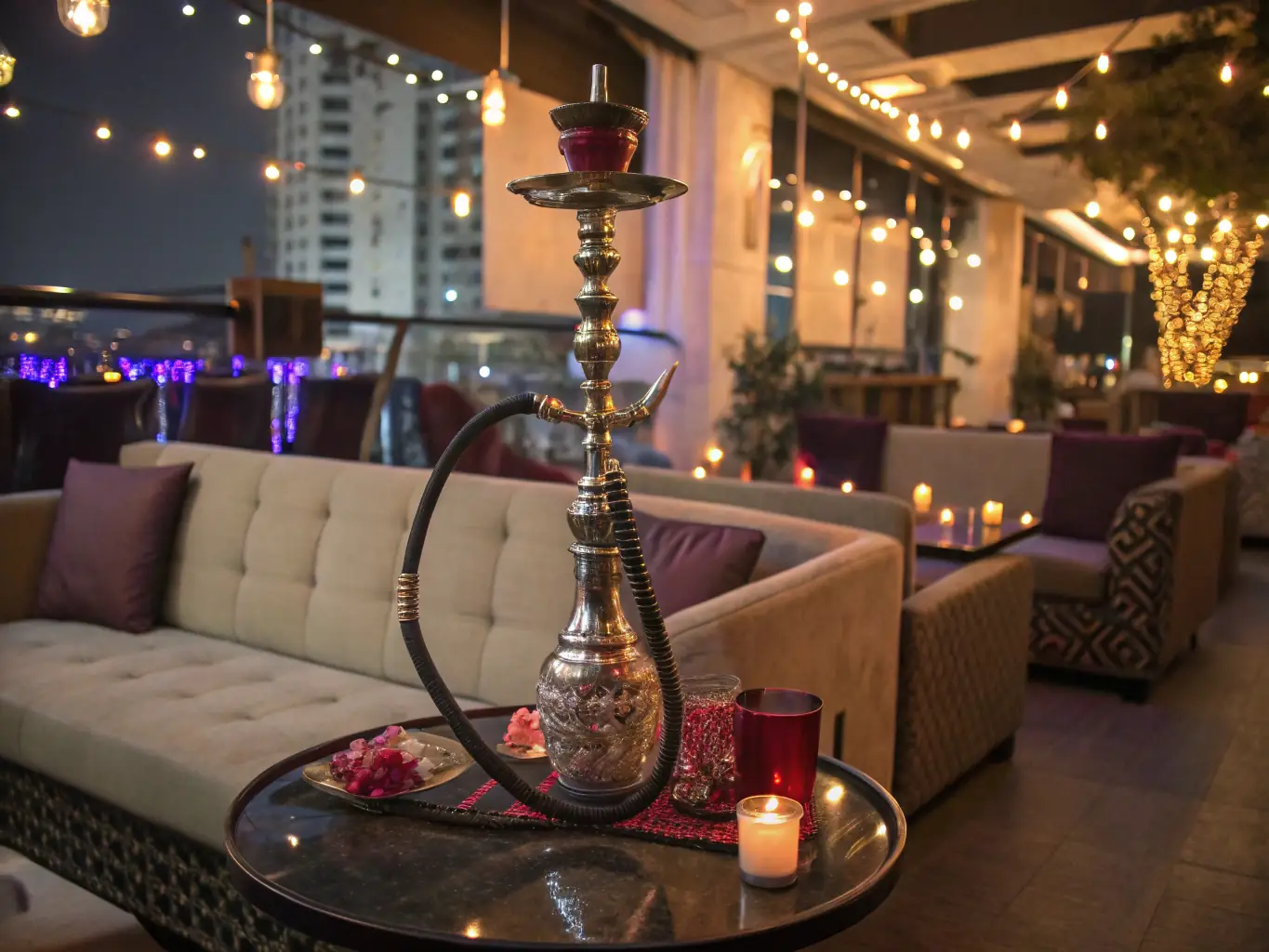 A photograph capturing the elegant interior of Qloud, showcasing comfortable seating, ambient lighting, and a relaxed atmosphere, with patrons enjoying hookah.